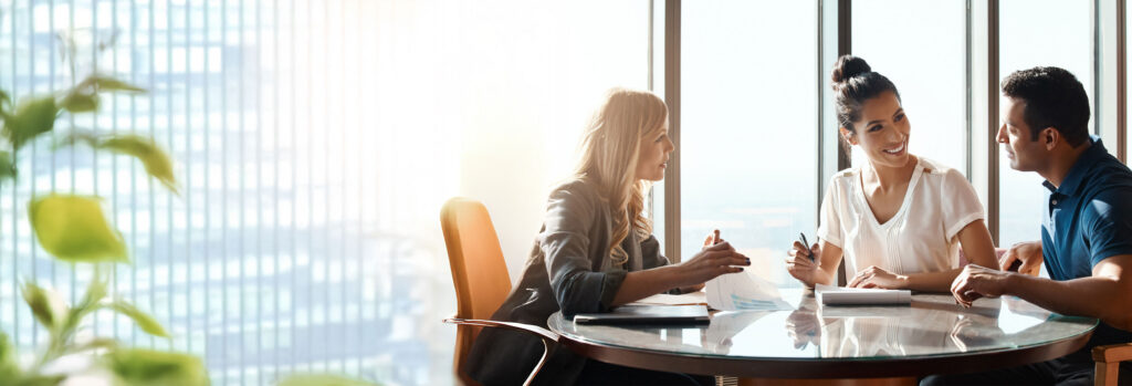 Couple discussing with an advisor
